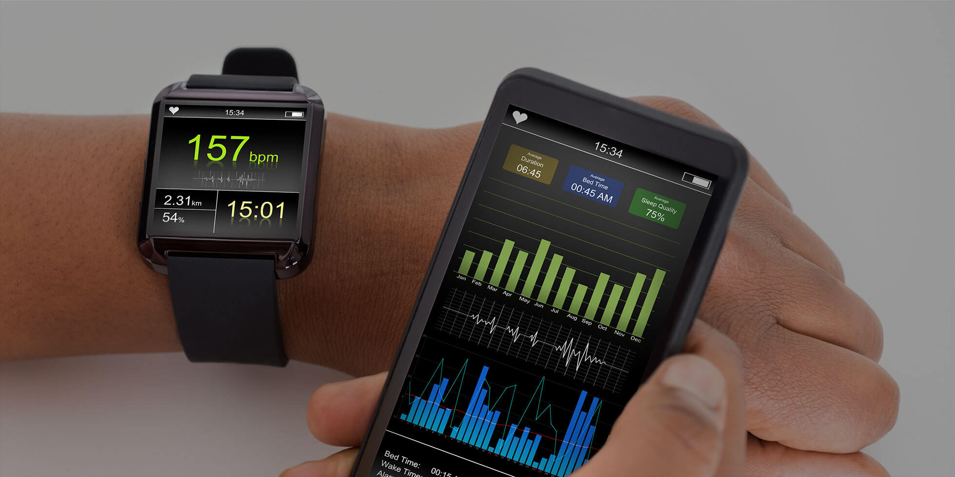 Image of person wearing smart watch displaying health metrics while holding a mobile phone with an app displaying more detailed results.
