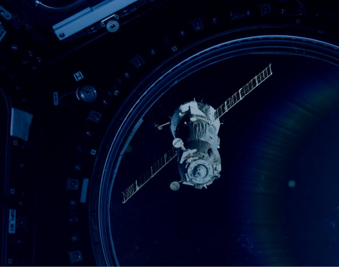 Image of a satellite floating in outer space.